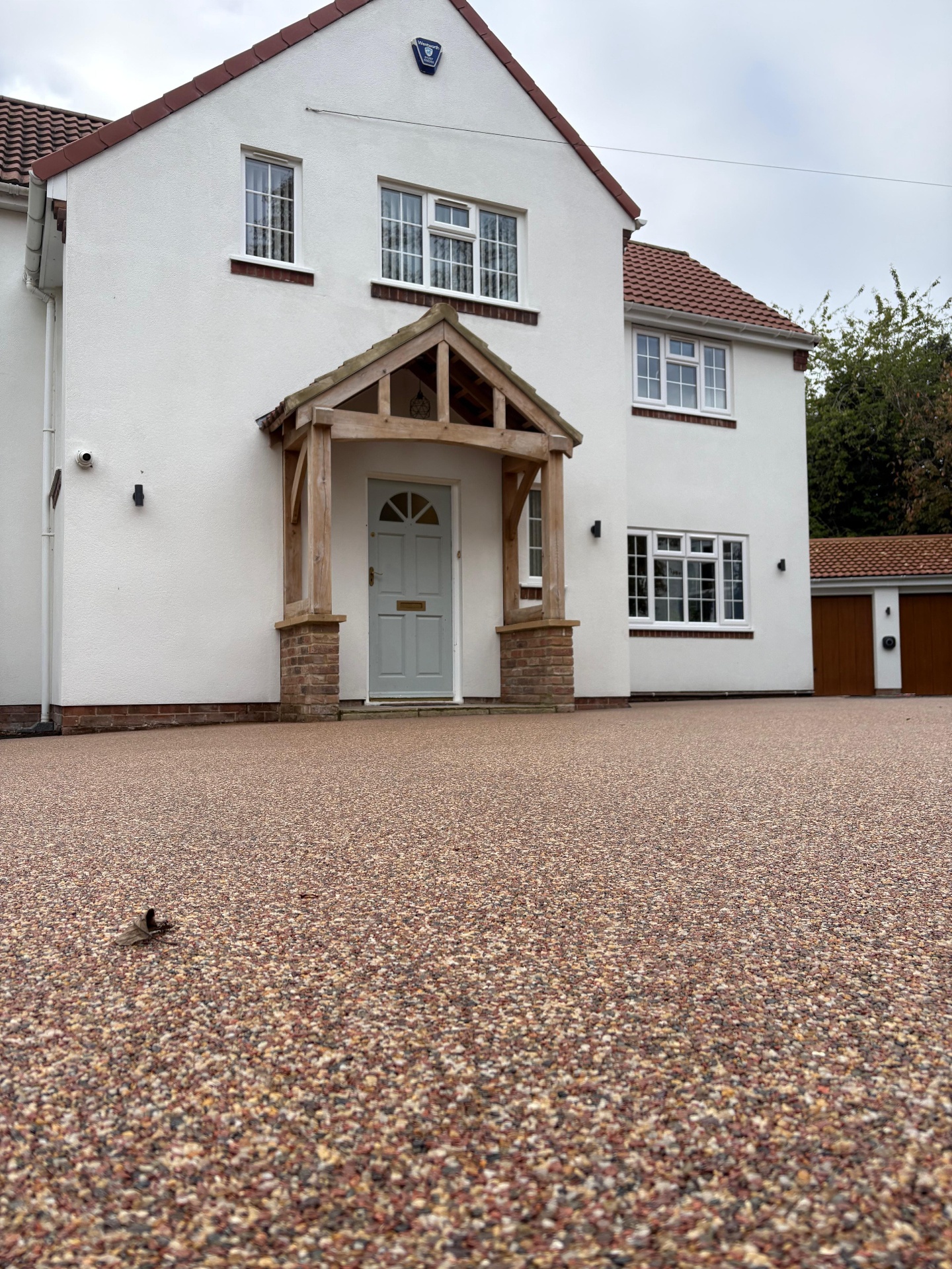 Wide resin bound driveway installed outside a detached house in the North East